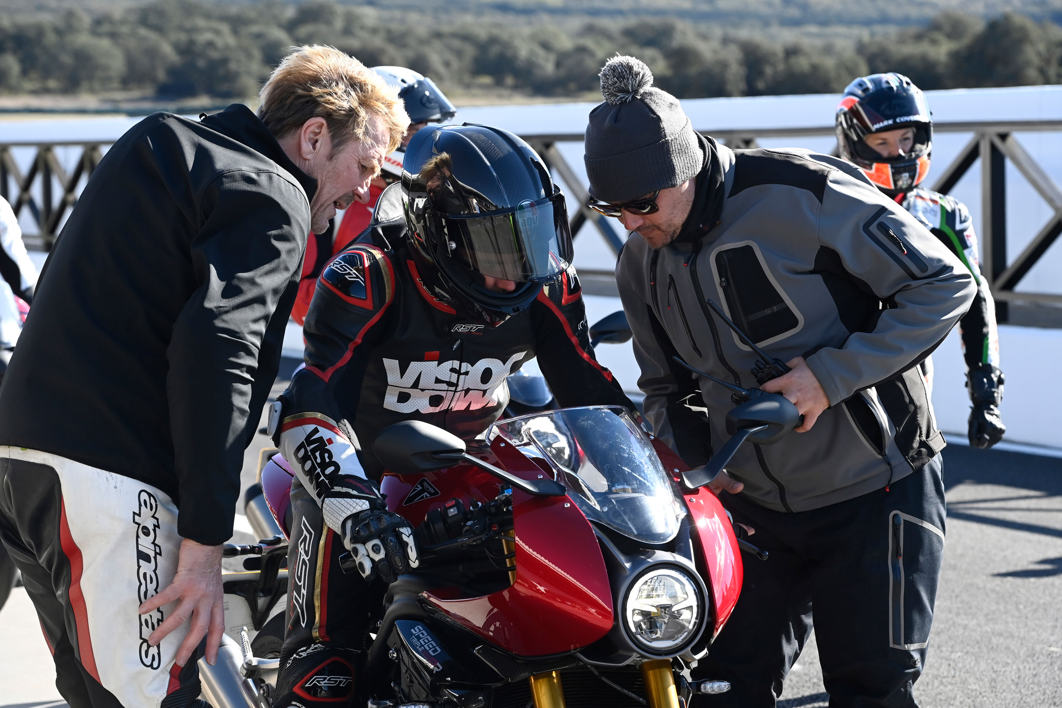 Gareth Bright, Alan Batson and a member of the motorcycle press on the Ascari circuit at Rhonda, Spain